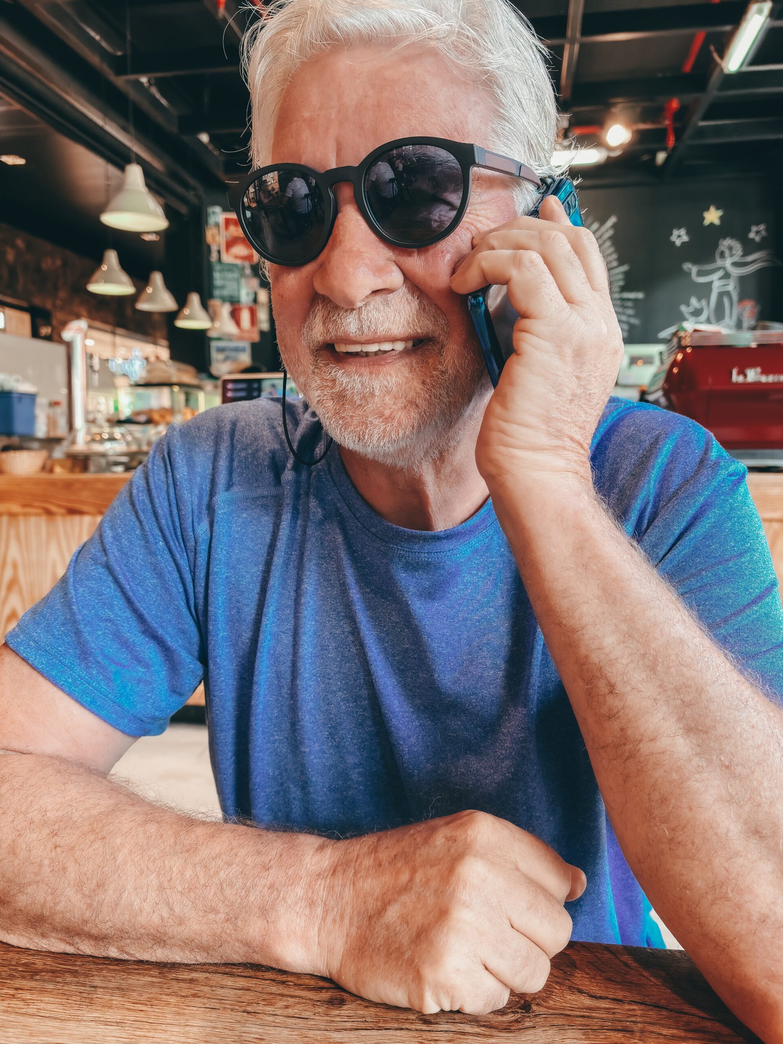 https://evmobilechargeoc.com/wp-content/uploads/2025/07/handsome-smiling-bearded-senior-man-sitting-at-caf-2024-11-02-23-42-07-utc-scaled.jpg